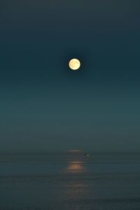 Close-up of moon over sea