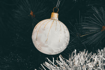 Close-up of christmas decoration hanging at night