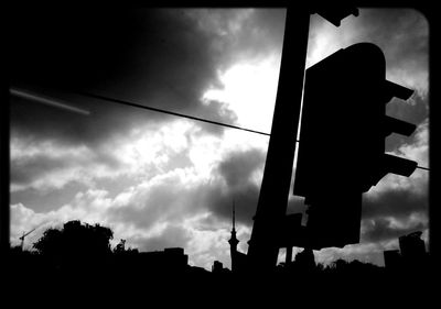 Low angle view of building against cloudy sky