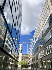 Low angle view of modern buildings against sky