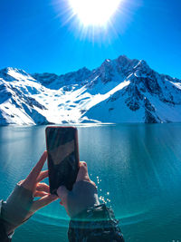 Scenic view of snowcapped mountains against blue sky