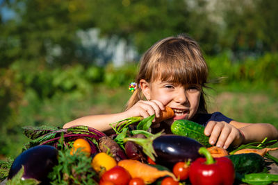 Portrait of girl with fresh bowl of vegetables