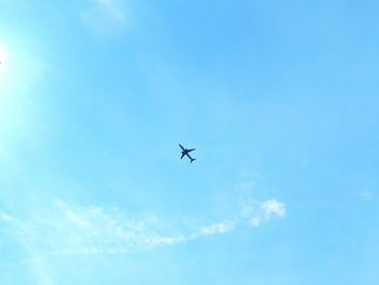 Low angle view of airplane flying in sky