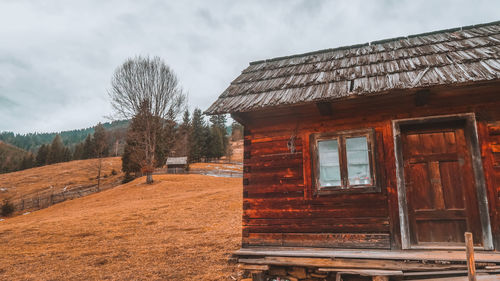 House on field against sky