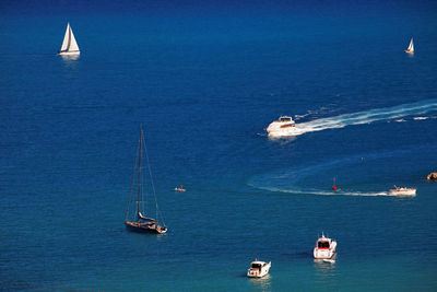High angle view of boats moving on sea