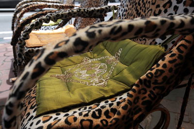 Close-up of empty chairs with cushions
