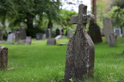 Stone cross in cemetery