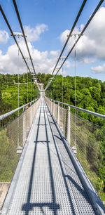 Footbridge against sky