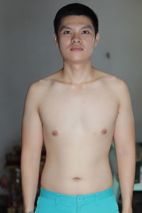 Portrait of shirtless young man