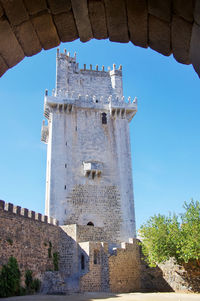 Low angle view of historical building against blue sky