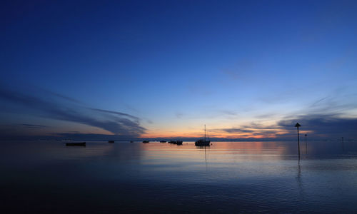 Scenic view of sea against sky at sunset