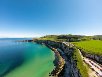 Scenic view of sea against clear blue sky