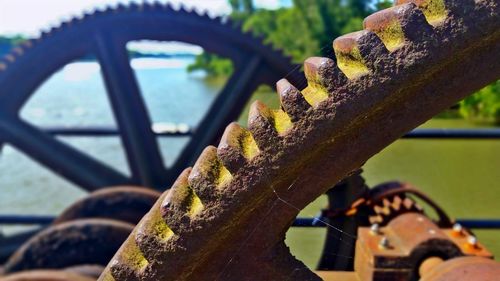 Close-up of rusty metal against sky