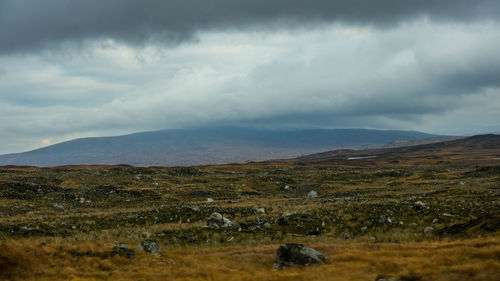 Scenic view of landscape against cloudy sky