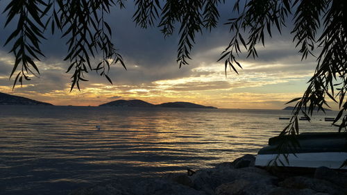 Scenic view of sea against sky at sunset