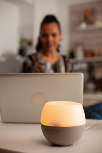 Young woman using laptop at home