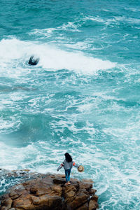 High angle view of people on sea shore