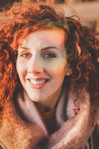 Close-up portrait of smiling young woman with reflection on face