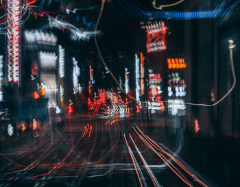 Light trails on illuminated city at night