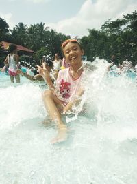 People enjoying in swimming pool