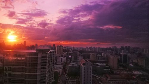 Cityscape against sky during sunset