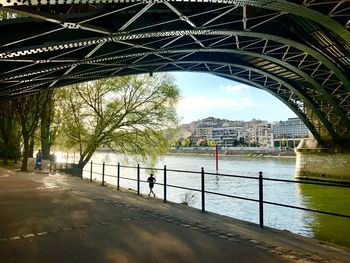 View of bridge in city against sky