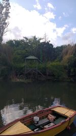 Reflection of trees in lake against sky