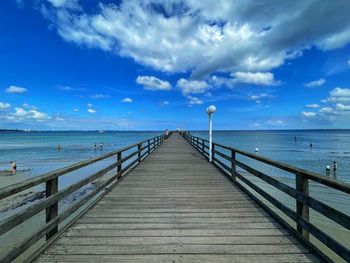 Pier over sea against sky