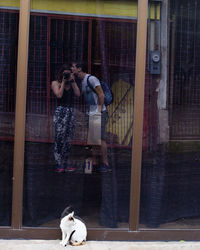 Man with dog on window