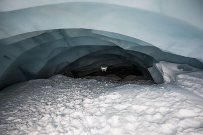 Drone flies deep into glacier cave to document climate change. precision
