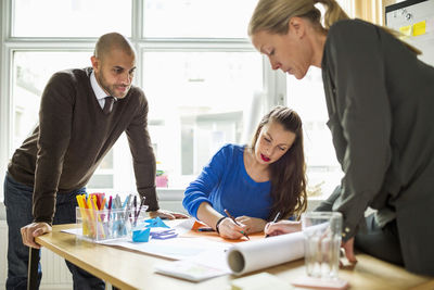 Business people working at desk in creative office