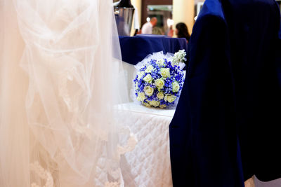 Close-up of couple holding bouquet