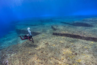 Person scuba diving at yonaguni island