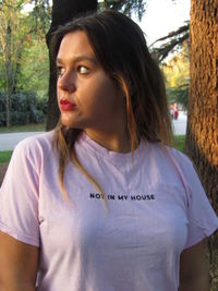 Portrait of beautiful young woman looking away