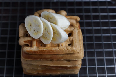 Waffles and banana slices on cooling rack