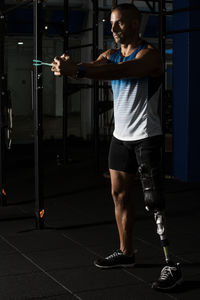 Determined disabled man exercising at gym