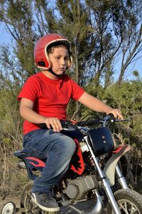 Portrait of boy riding bicycle