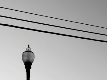 Single lamppost with power lines above