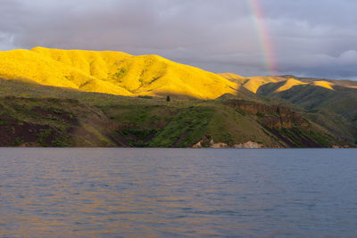 Scenic view of sea against yellow sky