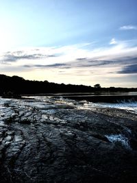 View of lake against cloudy sky