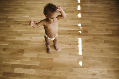 Toddler standing on floor