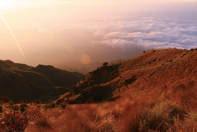 Scenic view of landscape against sky during sunset