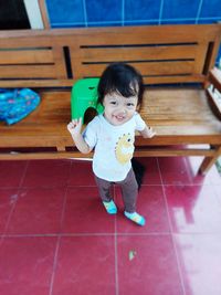 High angle portrait of cute girl at home