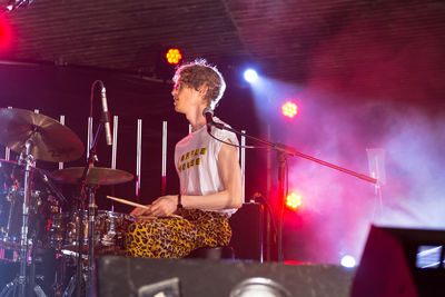 Full length of man performing at music concert