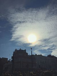 Low angle view of buildings against sky at sunset
