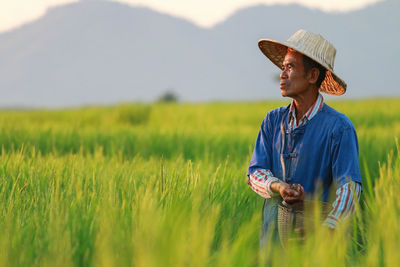 Full length of a man standing in field