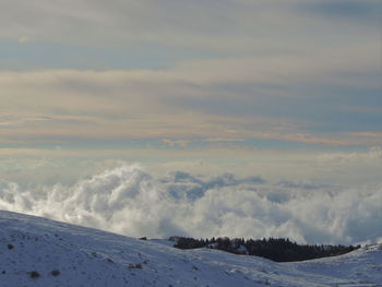 Scenic view of snow covered landscape against sky