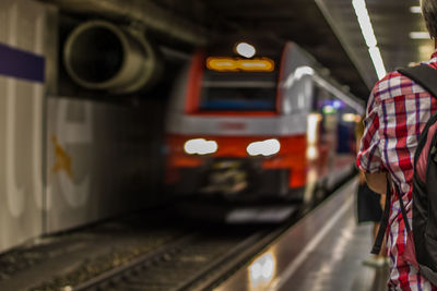 Blurred motion of train at railroad station at night