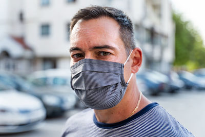 Portrait of man wearing sunglasses on street in city