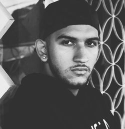 Close-up portrait of young man wearing cap